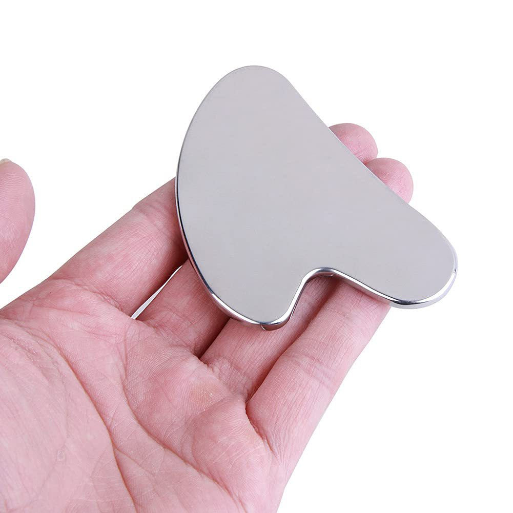 IBG stainless steel Gua Sha massage tool for facial and body care, featuring a smooth, curved design for skin massage and rejuvenation.