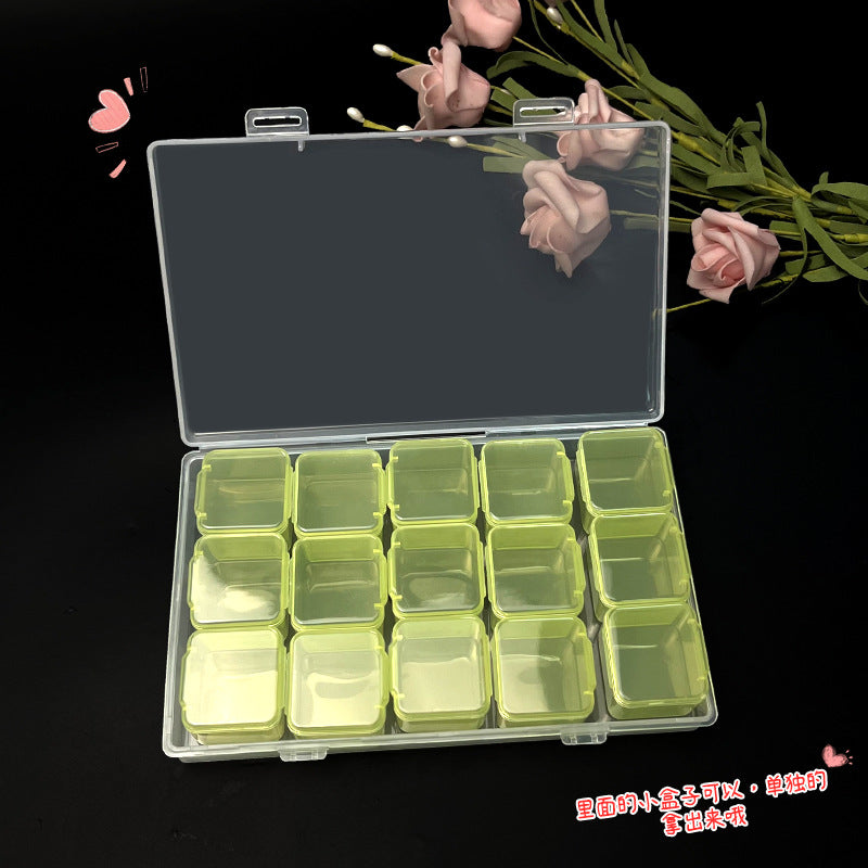 Transparent IBG jewelry storage box with multiple compartments for organizing rings, necklaces, and small accessories.