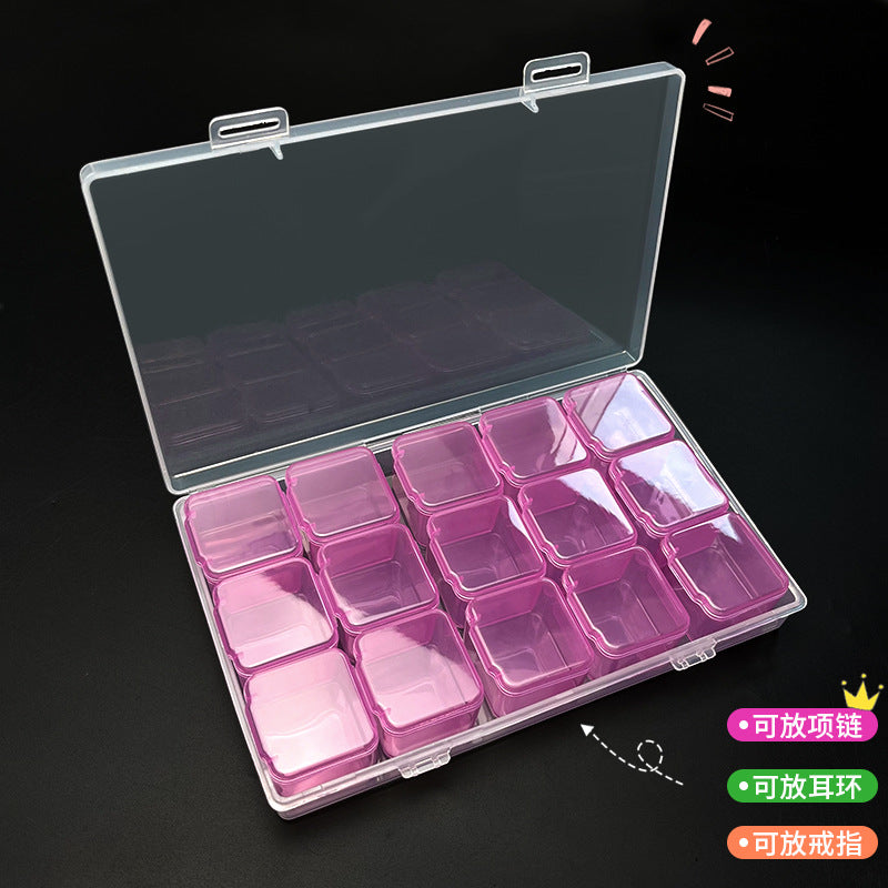 Clear IBG jewelry storage box with multiple compartments for organizing jewelry and small accessories on a home storage shelf.