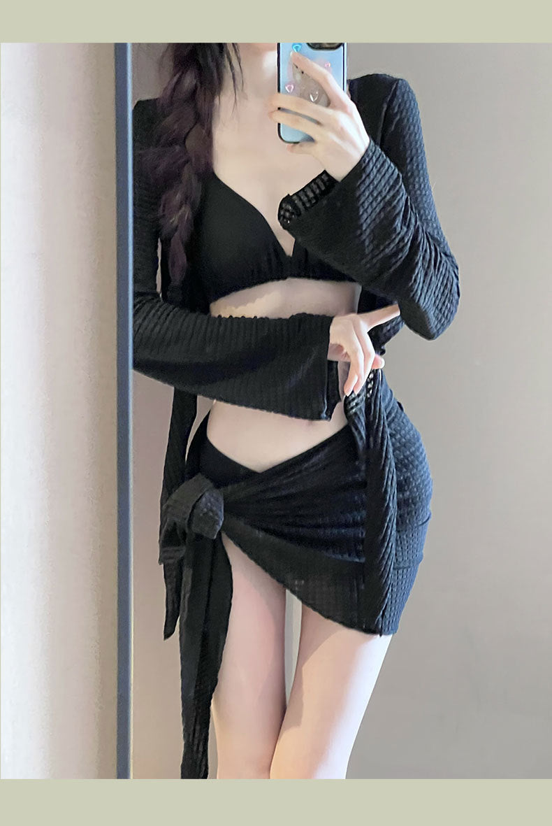 Women's IBG long sleeve swimsuit set with four pieces, featuring a stylish swimwear design and vibrant colors for beach or pool.