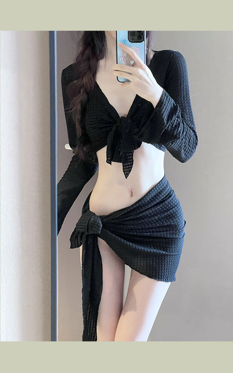 Women's IBG long sleeve swimsuit set with four-piece design, featuring stylish swimwear suitable for beach or pool.