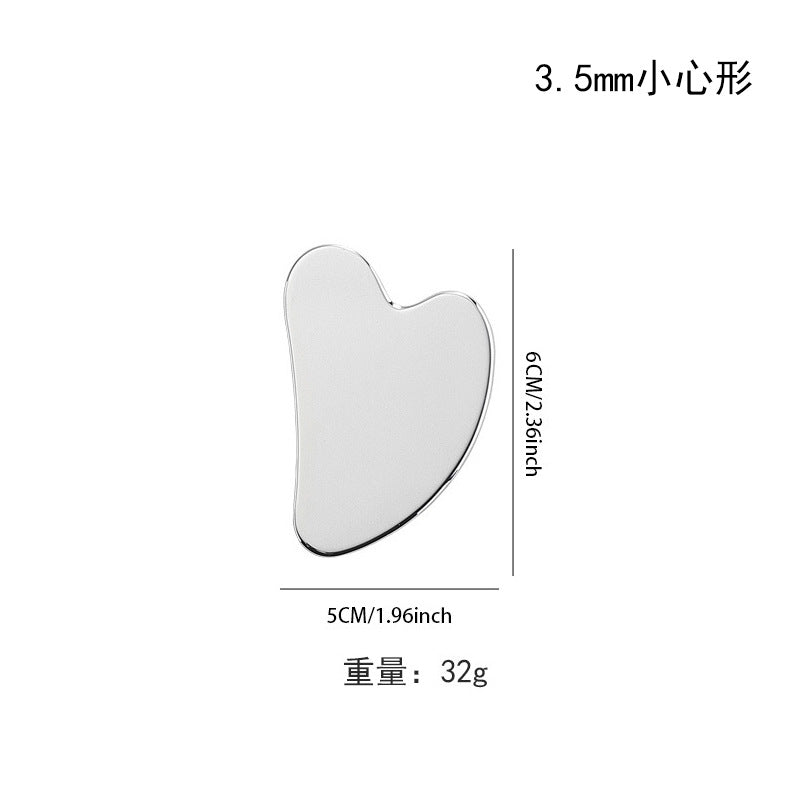 IBG stainless steel Gua Sha massage tool for facial and body skincare, featuring smooth, polished surface and ergonomic design
