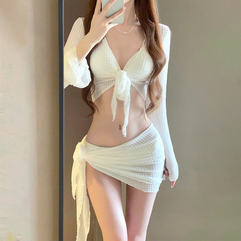Women's IBG 4-piece long sleeve swimsuit set with top, bottom, and accessories, perfect for stylish beach or pool days.