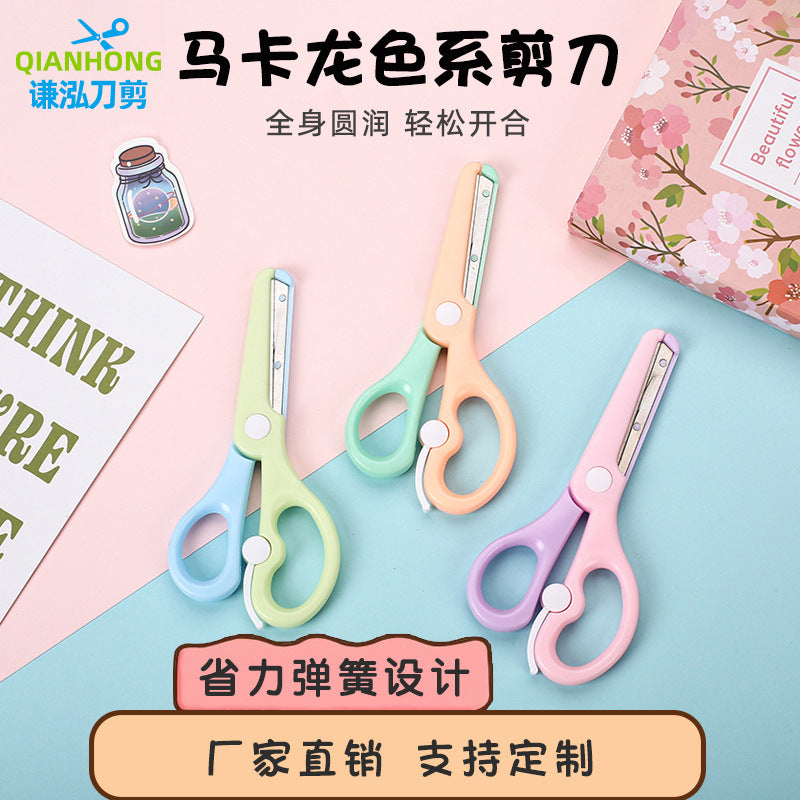 Kids safety scissors in macaron colors by IBG, featuring rounded tips and colorful handles for safe, easy cutting for children.