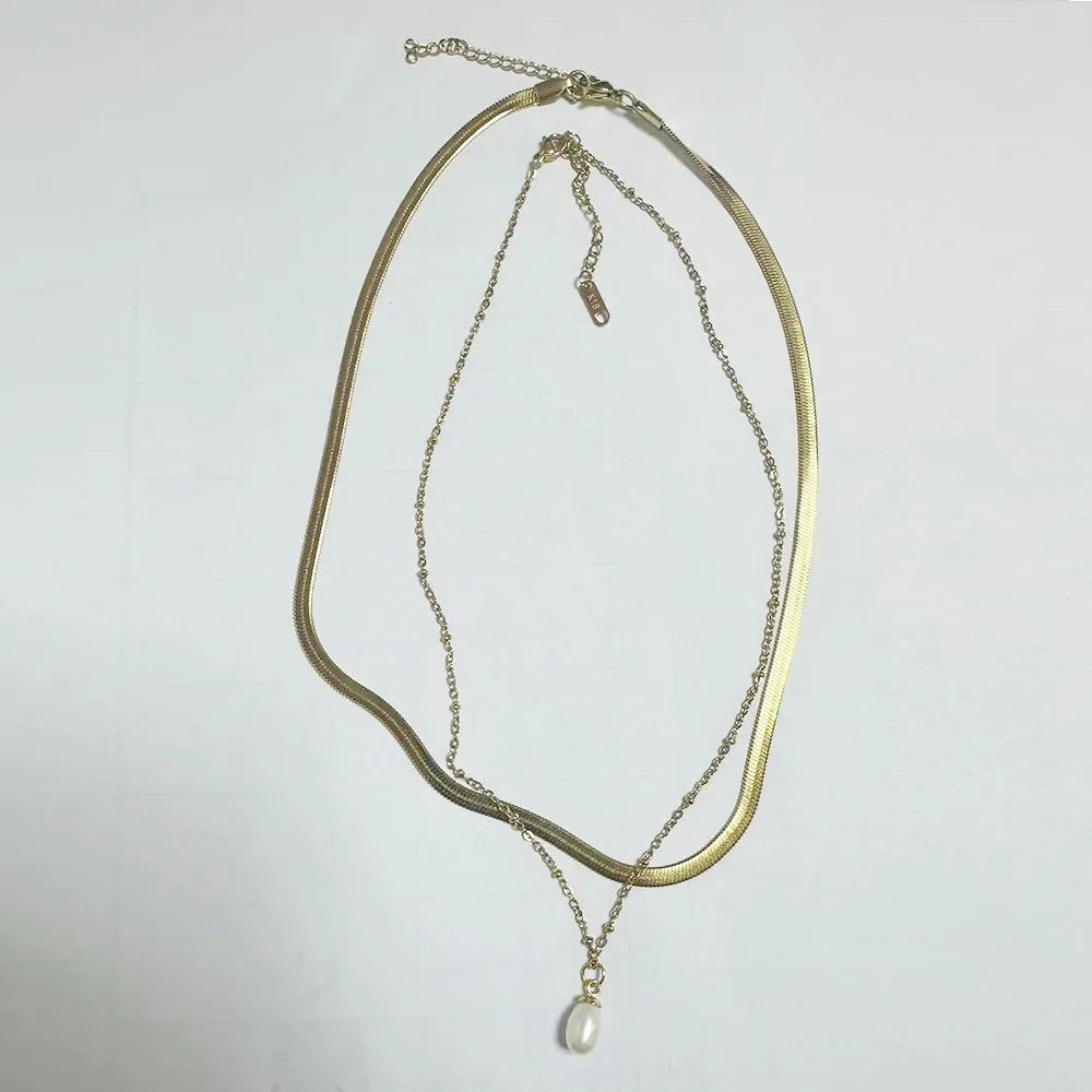 Stainless steel ball chain necklace by IBG, minimal everyday jewelry with small round beads on a sleek chain.