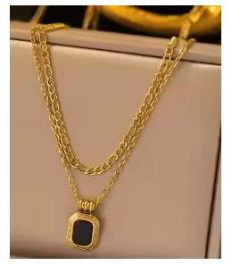 Stainless steel ball chain necklace by IBG, minimal everyday jewelry, showcasing a close-up of the sleek, silver chain.